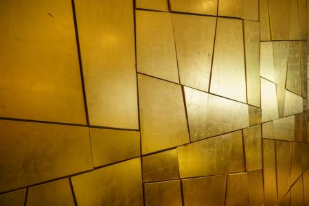 The Wall of Gold at the reception desk of the Hotel Du Nord in Interlaken